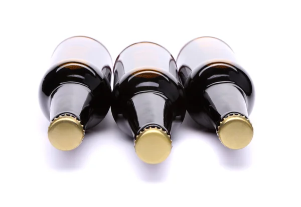 Three plugs on bottles of beer — Stock Photo, Image