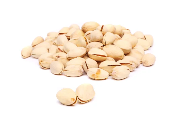 Pistachios heap on the white background close-up — Stock Photo, Image