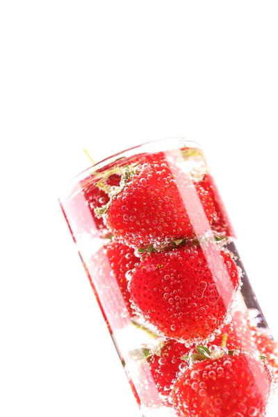 Strawberries and bubbles into glass — Stock Photo, Image