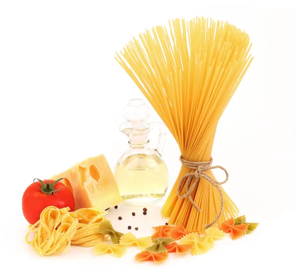 Different pasta, oil, tomato, cheese — Stock Photo, Image