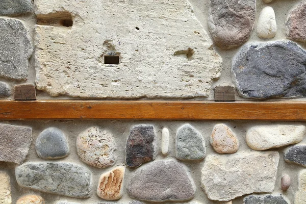 Houten plank betonnen in een stenen muur — Stockfoto