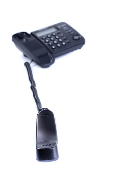 Černý telefon s uneseným off trubice — Stock fotografie