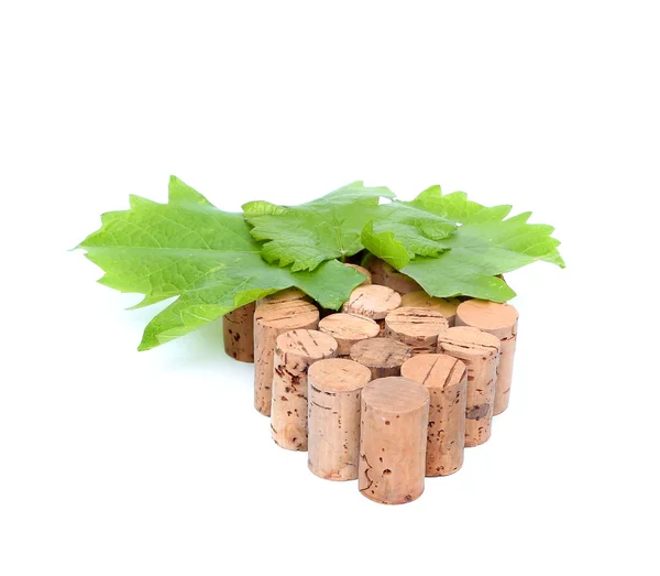 Bunch of wine corks and grape leaf — Stock Photo, Image