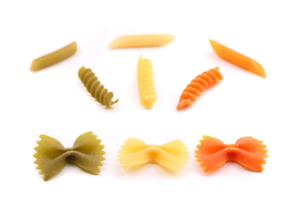 Samenstelling van verschillende pasta in drie kleuren. — Stockfoto
