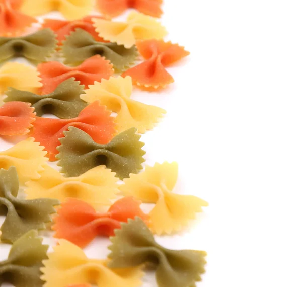 Background of the farfalle pasta three colors. — Stock Photo, Image