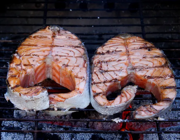 Two fresh salmon steaks cooked on BBQ — Stock Photo, Image