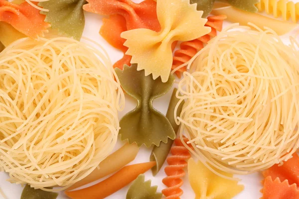 Capelli d'angelo on background of different pasta — Stock Photo, Image