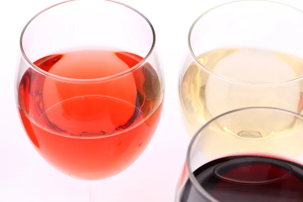 Three glasses with white, rose and red wine — Stock Photo, Image