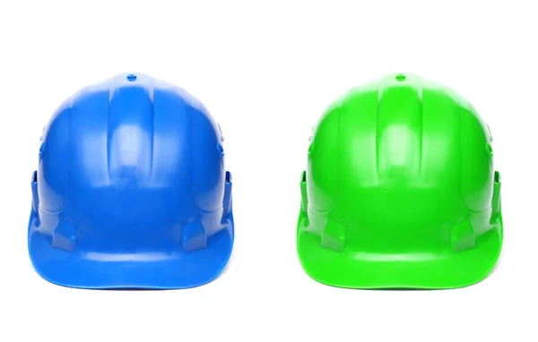 Niebieski i zielony twardym kapelusze — Zdjęcie stockowe