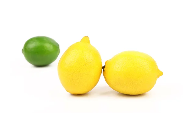 Fresh lime, two lemons isolated on white — Stock Photo, Image