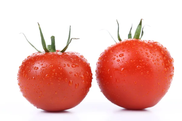 Dois tomates vermelhos maduros isolados — Fotografia de Stock