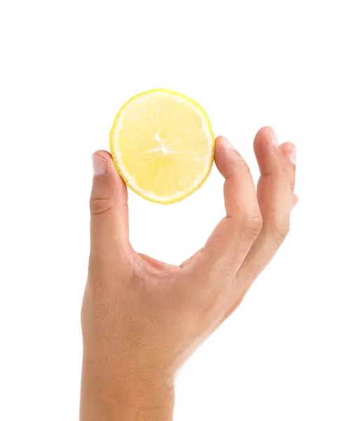 Hand holds lemon slice. — Stock Photo, Image