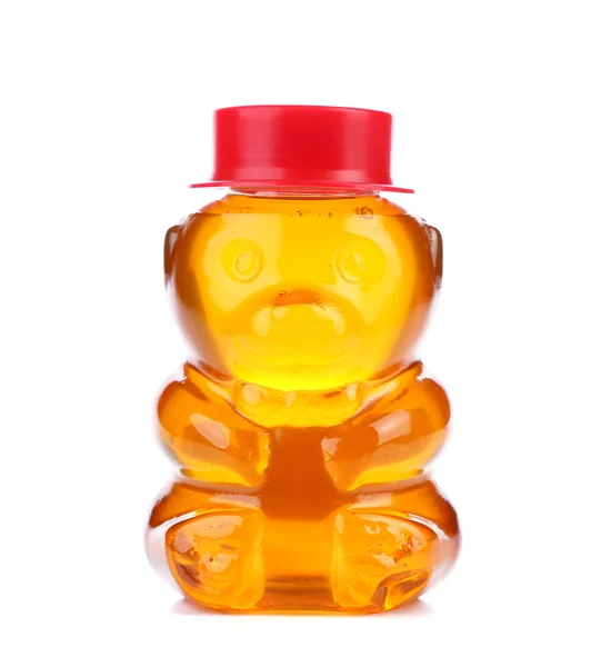 Garrafa em forma de urso e cheia de mel . — Fotografia de Stock