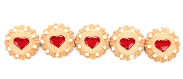 Row heart shaped strawberry biscuit. — Stock Photo, Image