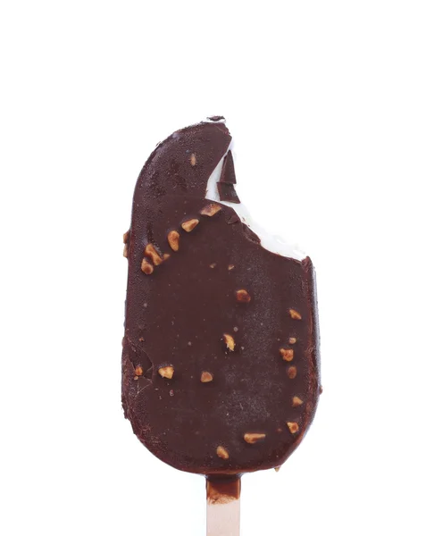 Bitten chocolate-coated ice cream on stick. — Stock Photo, Image