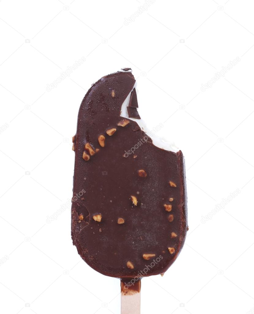 Bitten chocolate-coated ice cream on stick.