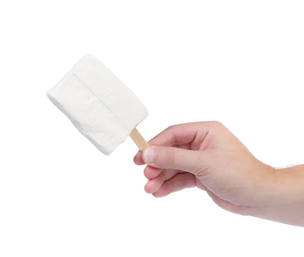 Hand holds white chocolate ice cream. — Stock Photo, Image