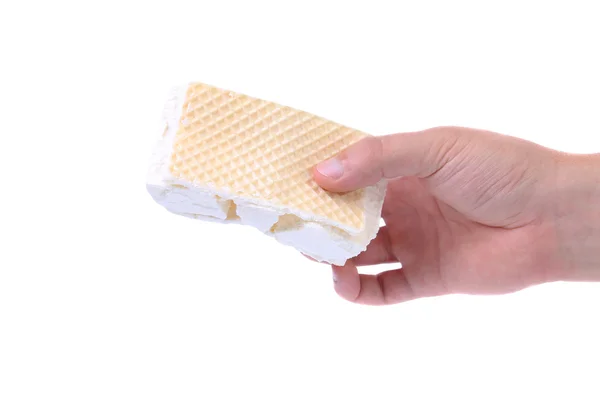 Hand houdt de gebroken vanille ijs. — Stockfoto