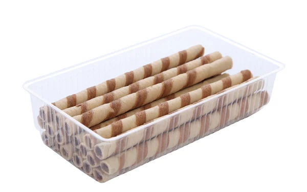 Waffle rolls with chocolate cream into box. — Stock Photo, Image