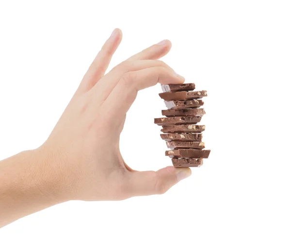 Hand holds milk chocolate with nuts. — Stock Photo, Image