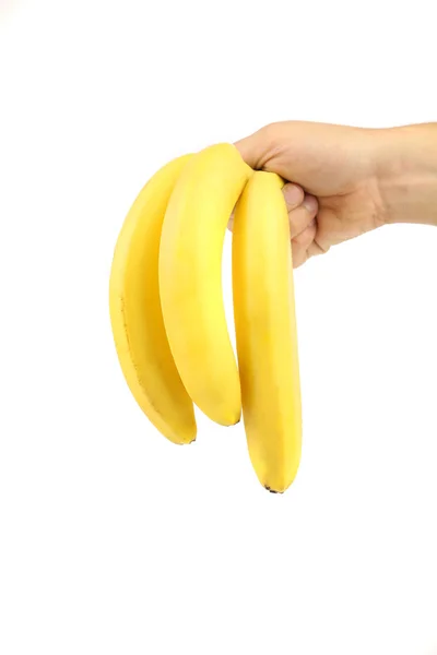 Hand houdt bos van bananen. — Stockfoto