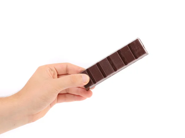 Hand holds dark chocolate bar. — Stock Photo, Image