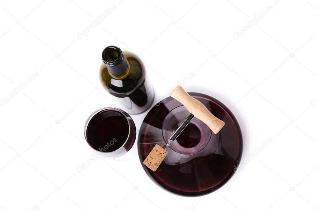 Decanter, bottle and glass with red wine top view.