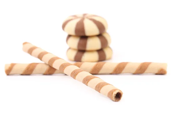 Chocolate striped wafer rolls and stake biscuits. — Stock Photo, Image