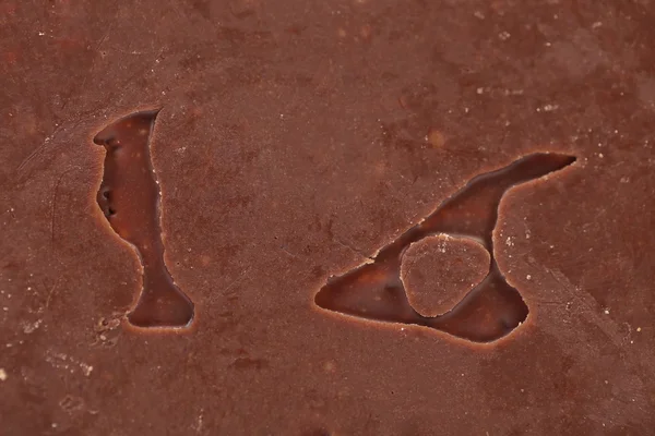 Seize chiffres gravés dans un fond de chocolat — Photo