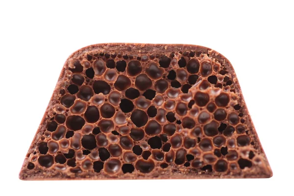 Knippen van poreuze melkchocolade. — Stockfoto