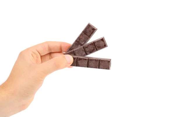 Hand holds three chocolate bars. — Stock Photo, Image