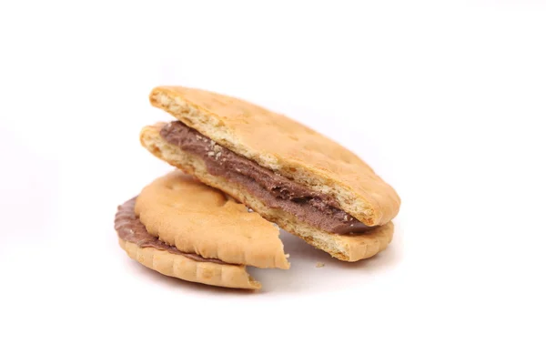 Broken sandwich biscuits with chocolate cream. — Stock Photo, Image