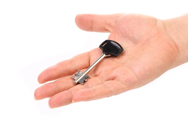 Hand holds modern steel-plastic key. — Stock Photo, Image