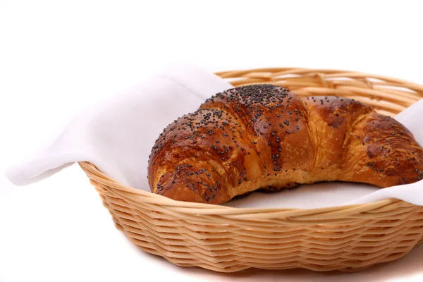 Image of croissant with poppy in a basket. — Stock Photo, Image