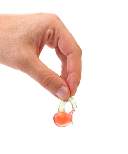 Hand hold fruit jelly in form of cherries. — Stock Photo, Image