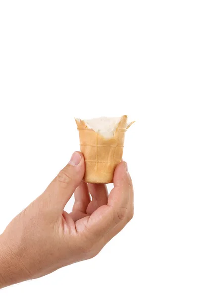 Hand holds bitten ice cream. — Stock Photo, Image