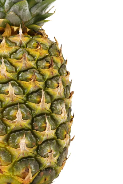 Pineapple is located half of a white background Royalty Free Stock Images