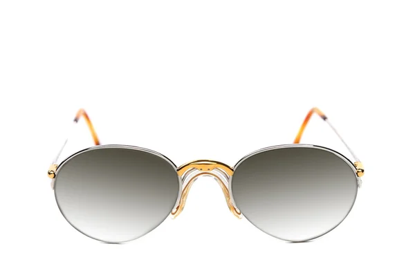 Солнечные очки из желтого и белого золота — стоковое фото
