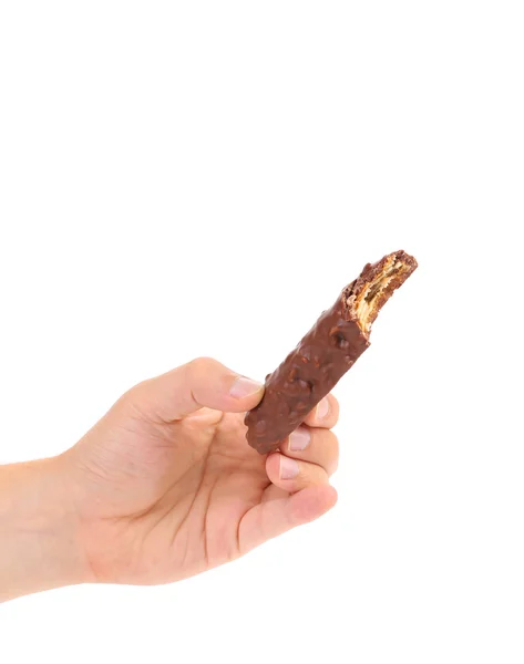Main tient mordu barre de chocolat . — Photo