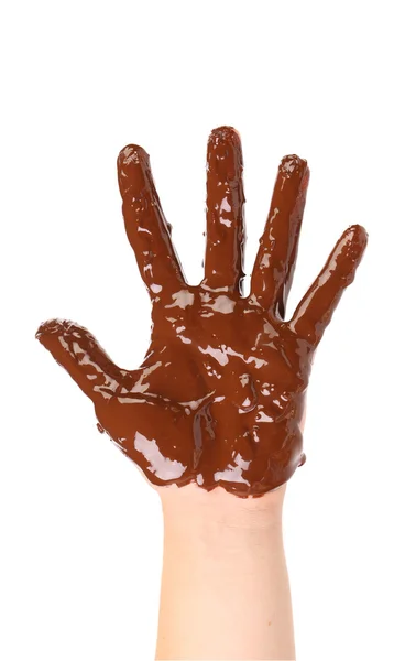 Children's hand stained with chocolate frosting. — Stock Photo, Image