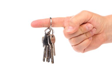 Hand holds bunch of keys.