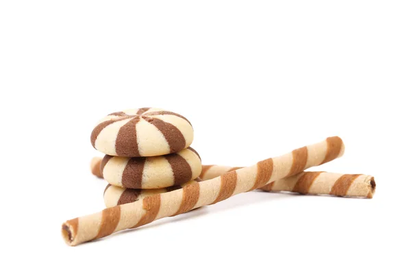 Striped chocolate wafer rolls and stake biscuits. — Stock Photo, Image