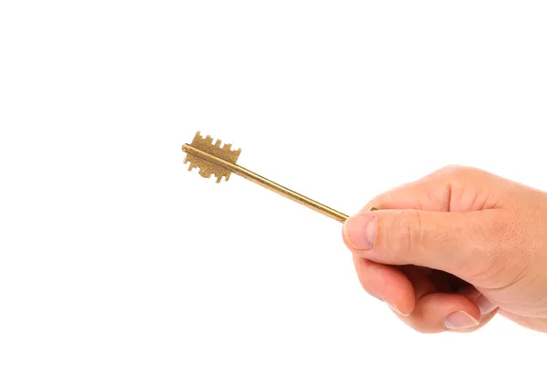 Hand holds bronze steel key. — Stock Photo, Image