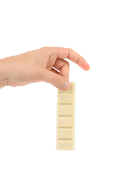 Hand holds white chocolate bar with filling — Stock Photo, Image