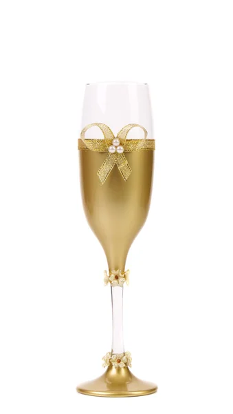 Decorated wedding golden glass wuth bow. — Stock Photo, Image