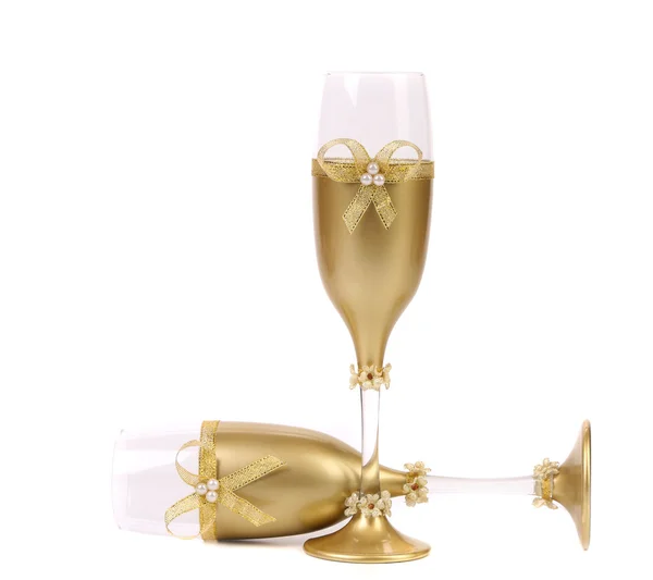 Decorated wedding golden glasses wuth bow. — Stock Photo, Image