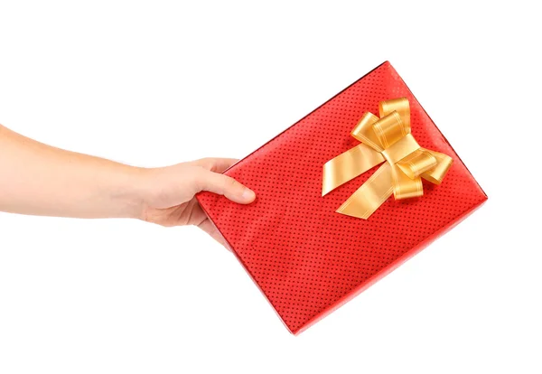 Rote Geschenkschachtel mit Flecken und goldener Schleife. — Stockfoto