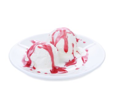 White ice cream and red syrop on a plate.