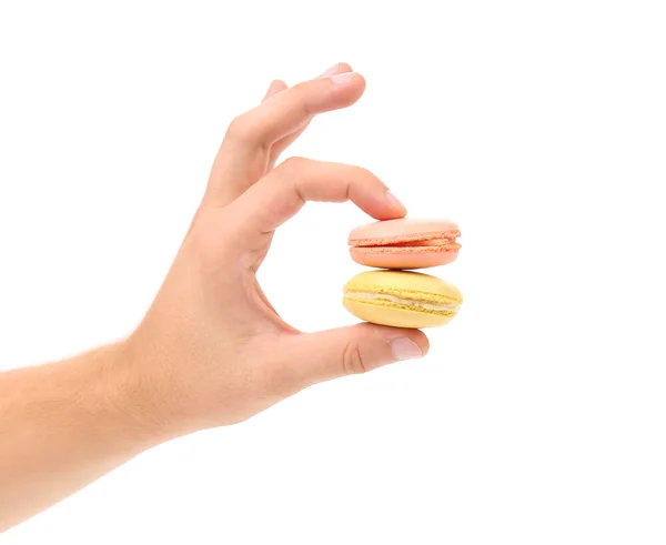 Hand hält Macarons. — Stockfoto