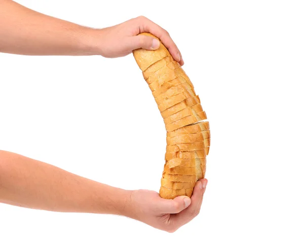 Hands holds sliced long loaf. — Stock Photo, Image